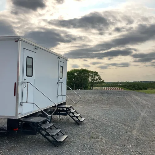 Rocket Restrooms trailer set up at an outdoor vineyard venue